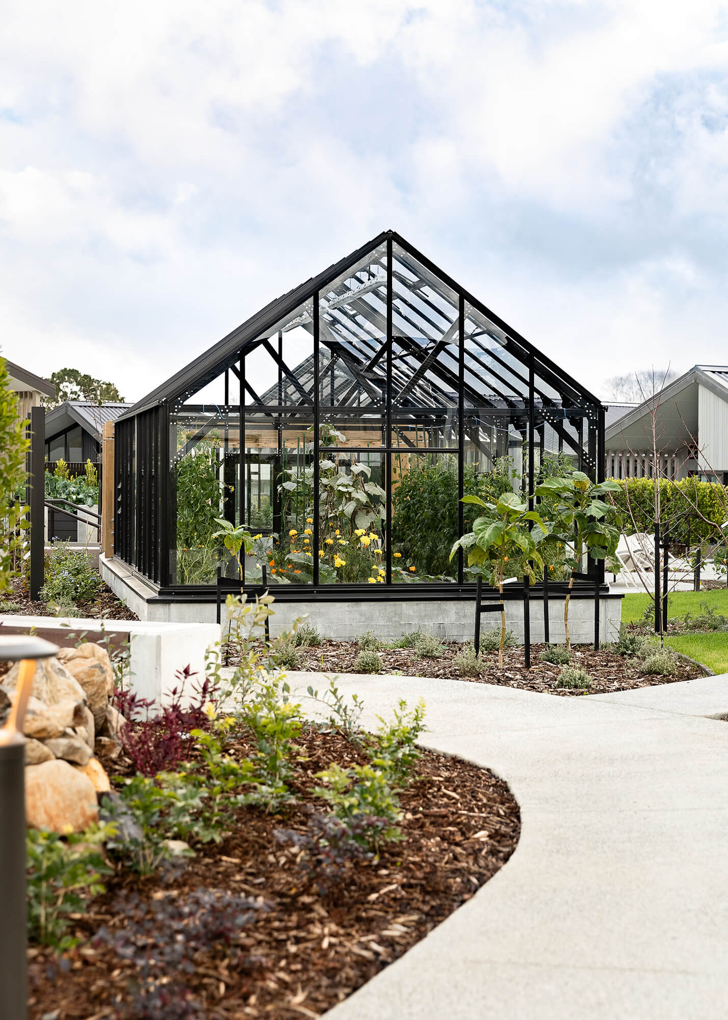 Large Winter Gardenz glasshouse in the centre of the community garden.