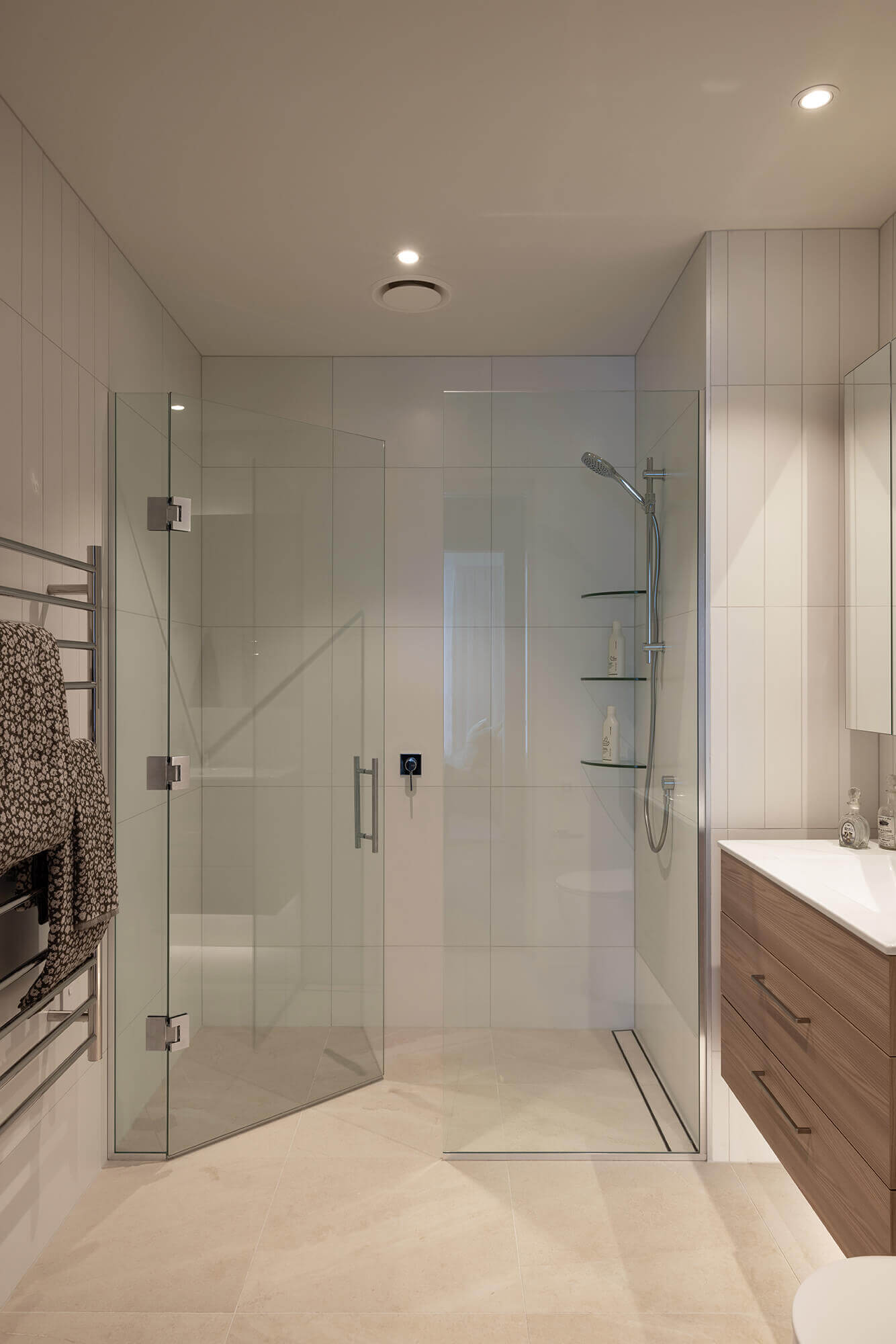 Large double glass walk-in shower in the floor to ceiling tiled master bedroom ensuite.