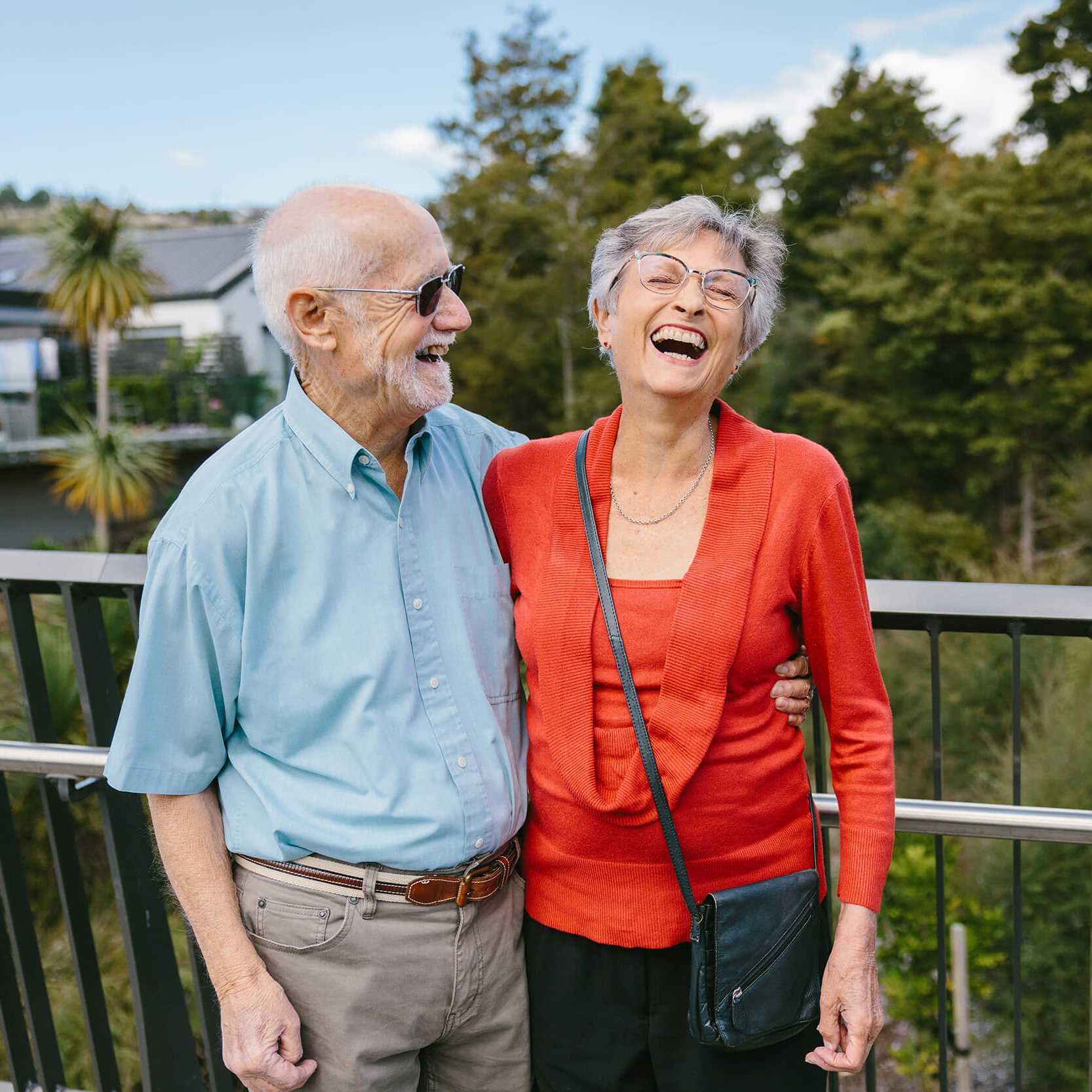 Couple laughing on bridge at The Botanic, Silverdale.